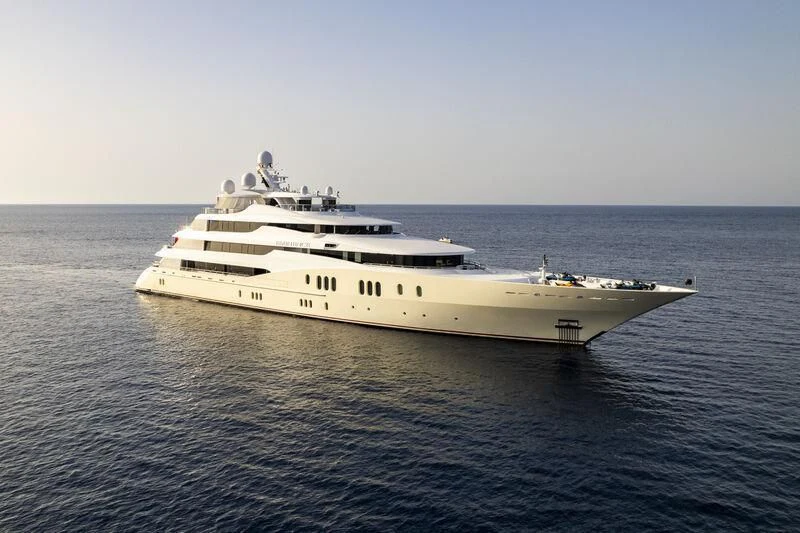 a white yacht in the water aboard EMINENCE Yacht for Sale
