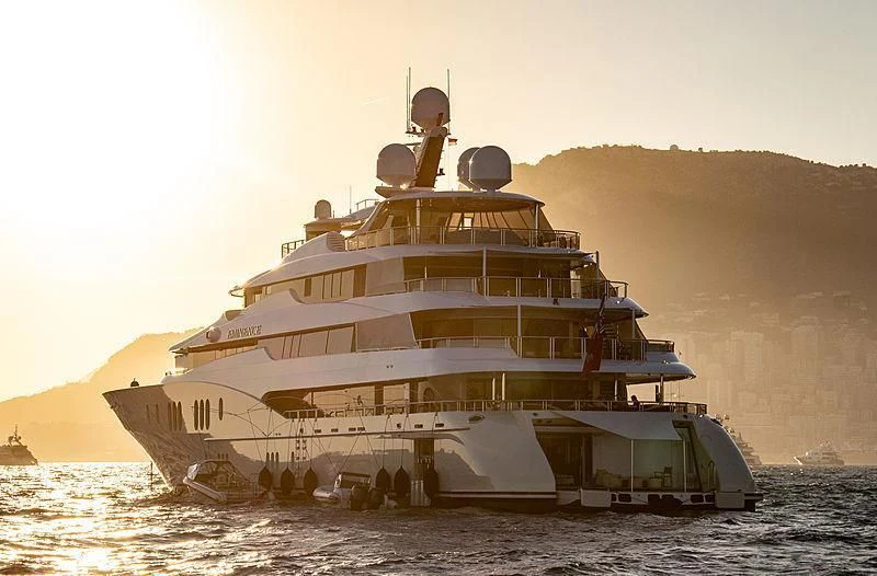 a large ship on the water aboard EMINENCE Yacht for Sale