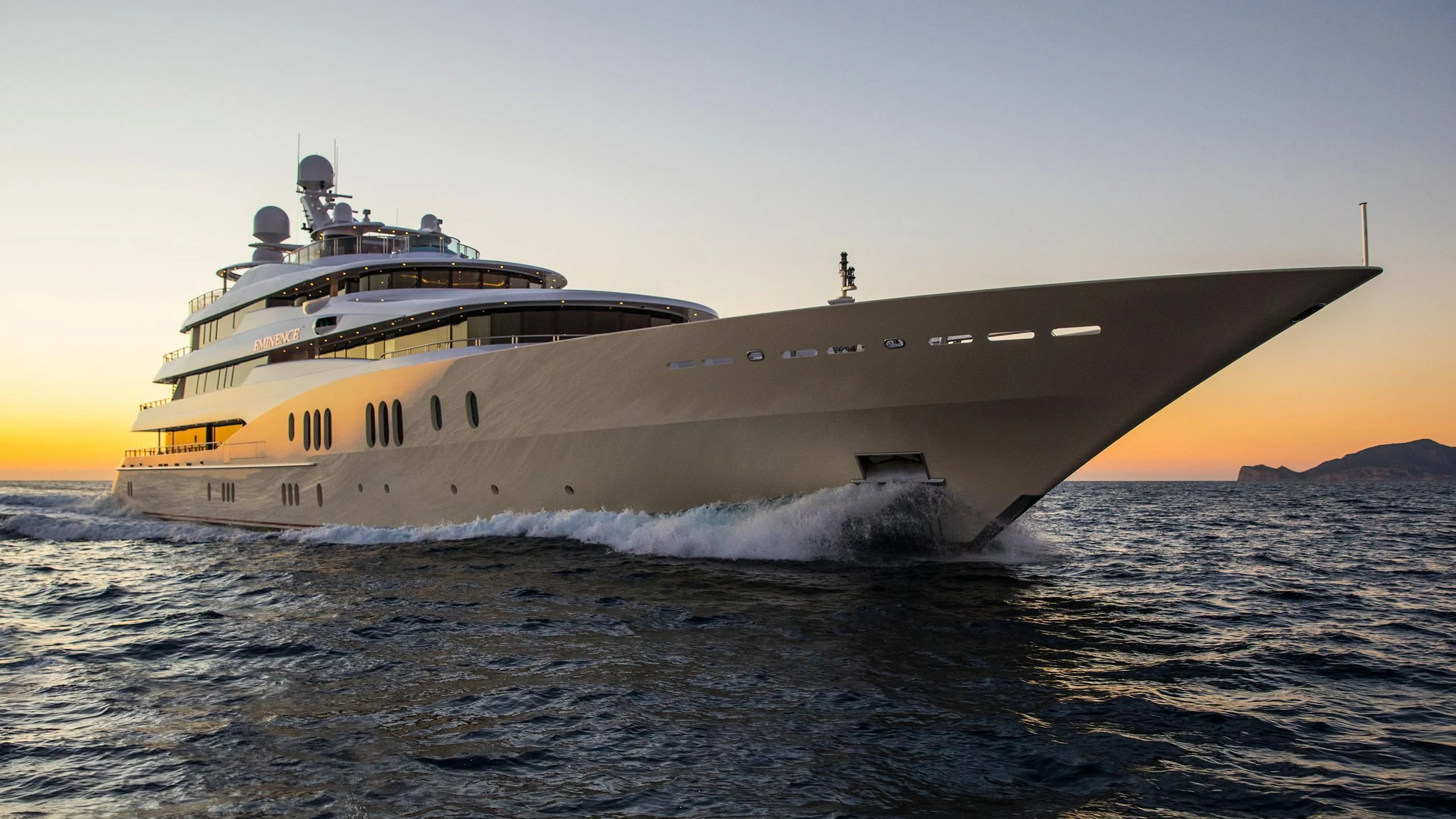 a large ship in the water aboard EMINENCE Yacht for Sale