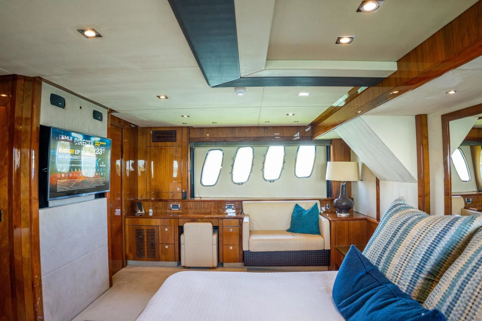 a room with a bed and a television aboard THE CABANA Yacht for Sale