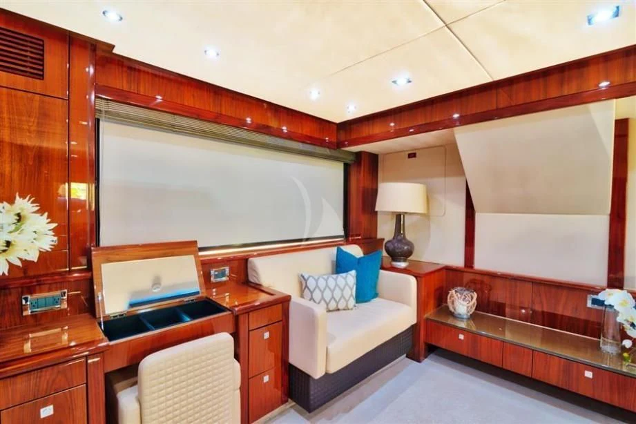 a room with a bed and a desk aboard THE CABANA Yacht for Sale