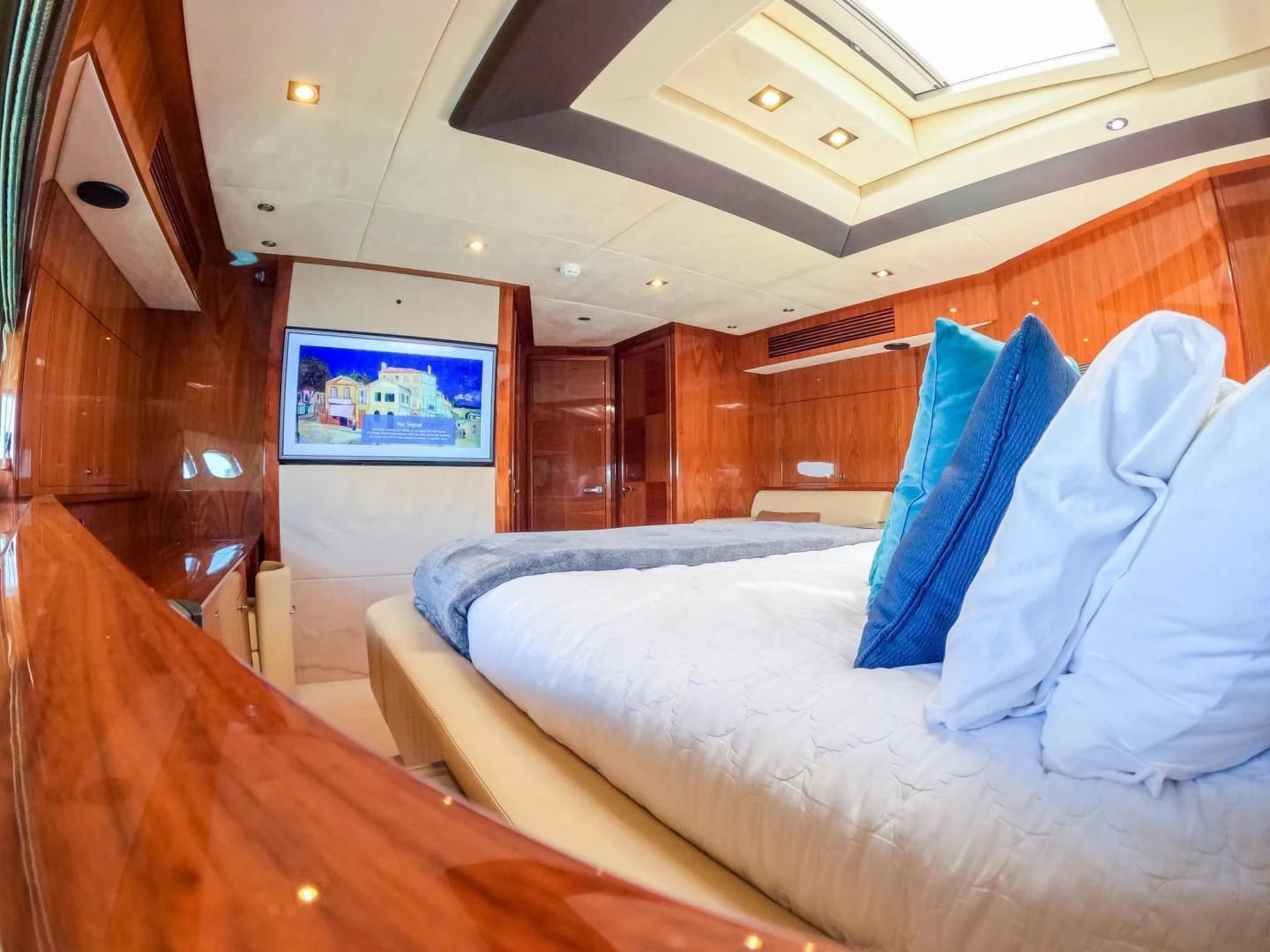 a room with a bed and a wood wall aboard THE CABANA Yacht for Sale