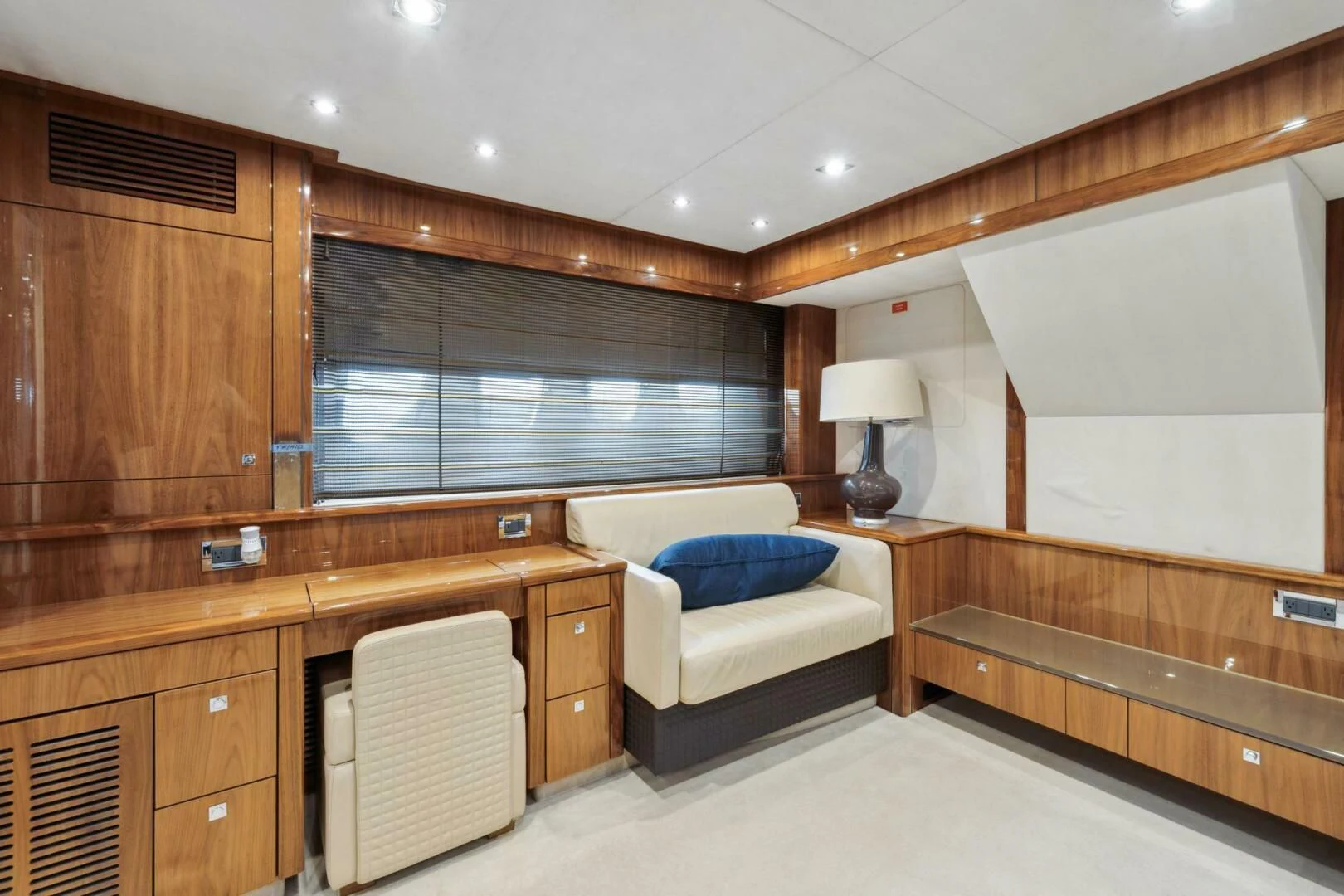 a room with a bed and a desk aboard THE CABANA Yacht for Sale