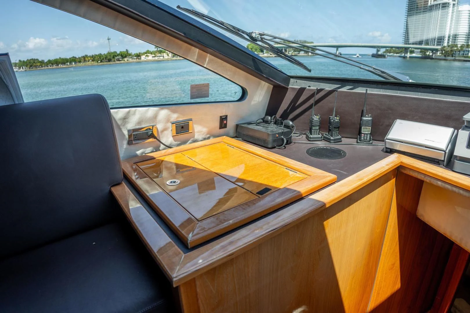 a wooden desk with a computer on it aboard THE CABANA Yacht for Sale