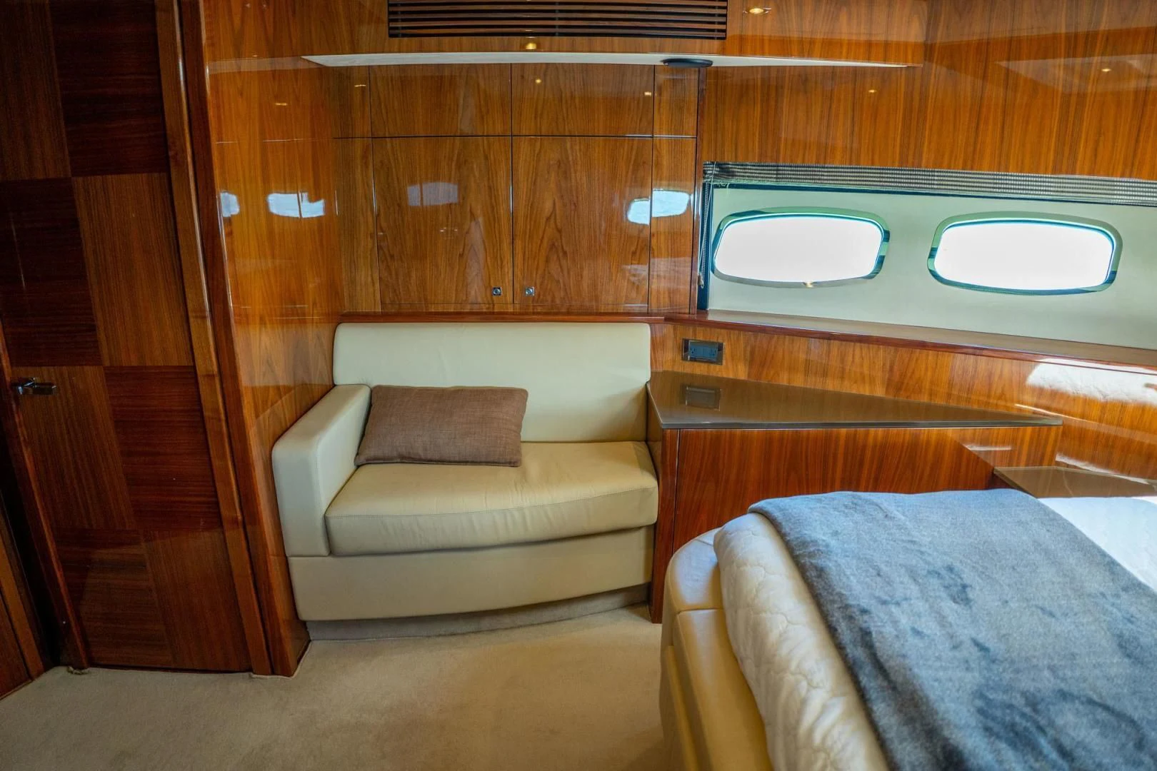 a room with a bed and a couch aboard THE CABANA Yacht for Sale