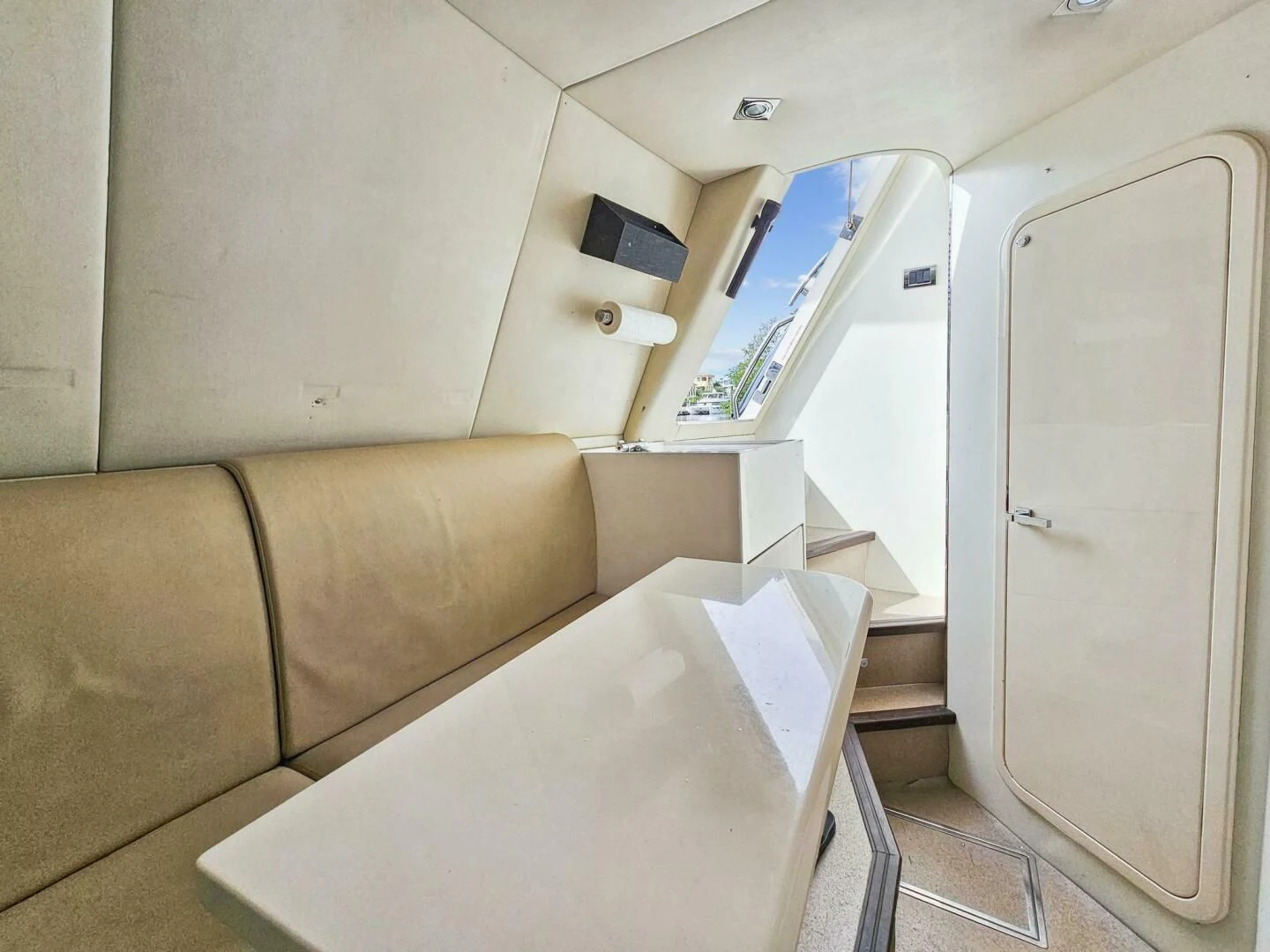a couch and a chair in a room aboard THE CABANA Yacht for Sale