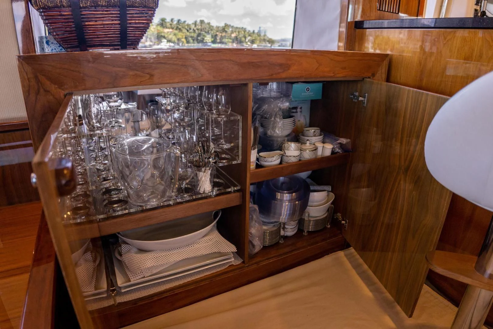 a wooden cabinet with a glass top aboard THE CABANA Yacht for Sale