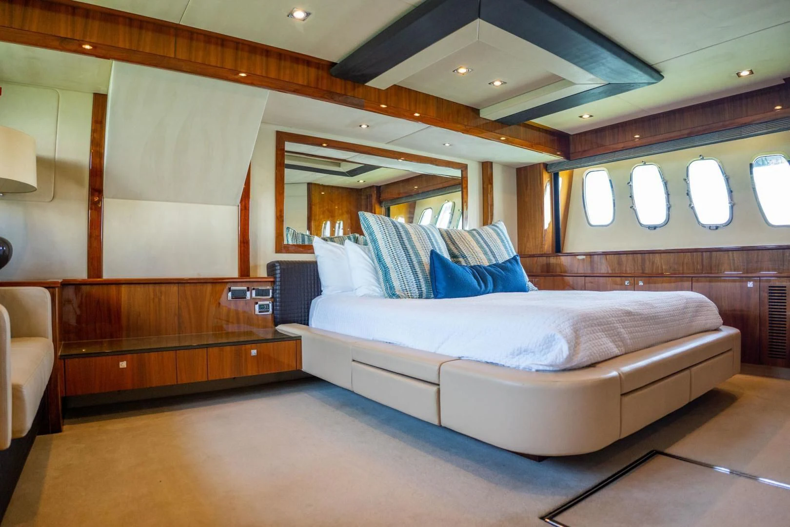 a room with a bed and a desk aboard THE CABANA Yacht for Sale