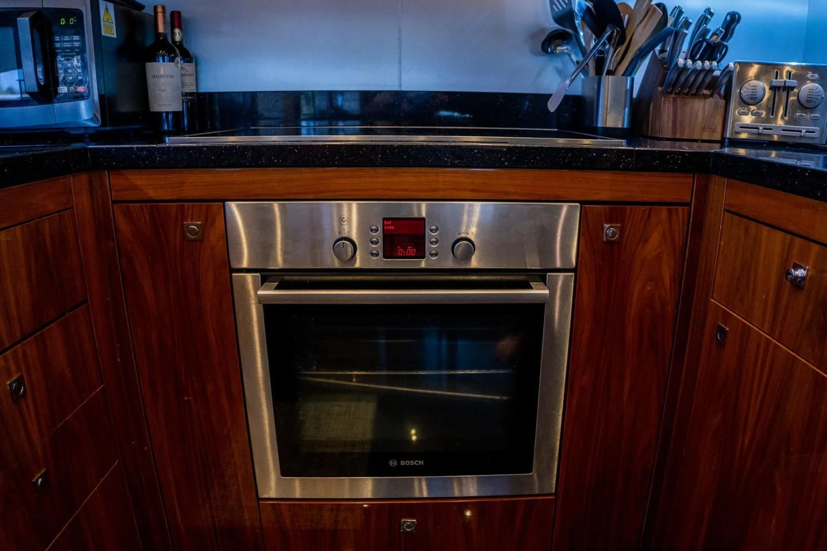 a kitchen with a stainless steel oven aboard THE CABANA Yacht for Sale