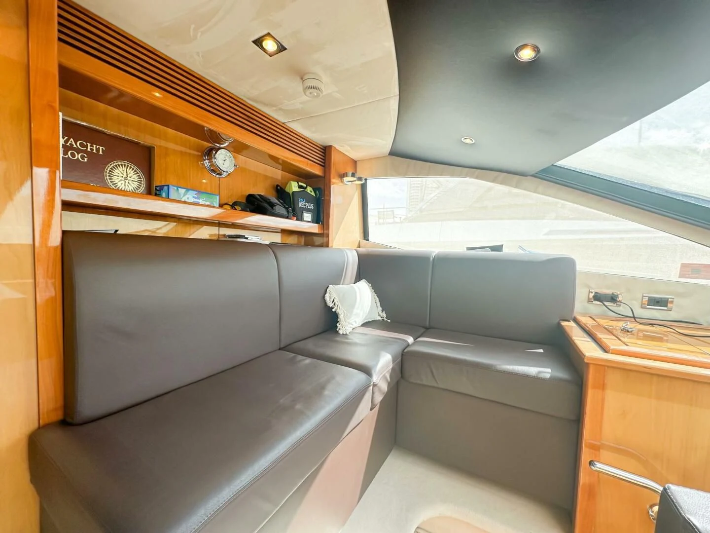 a room with a bed and desk aboard THE CABANA Yacht for Sale