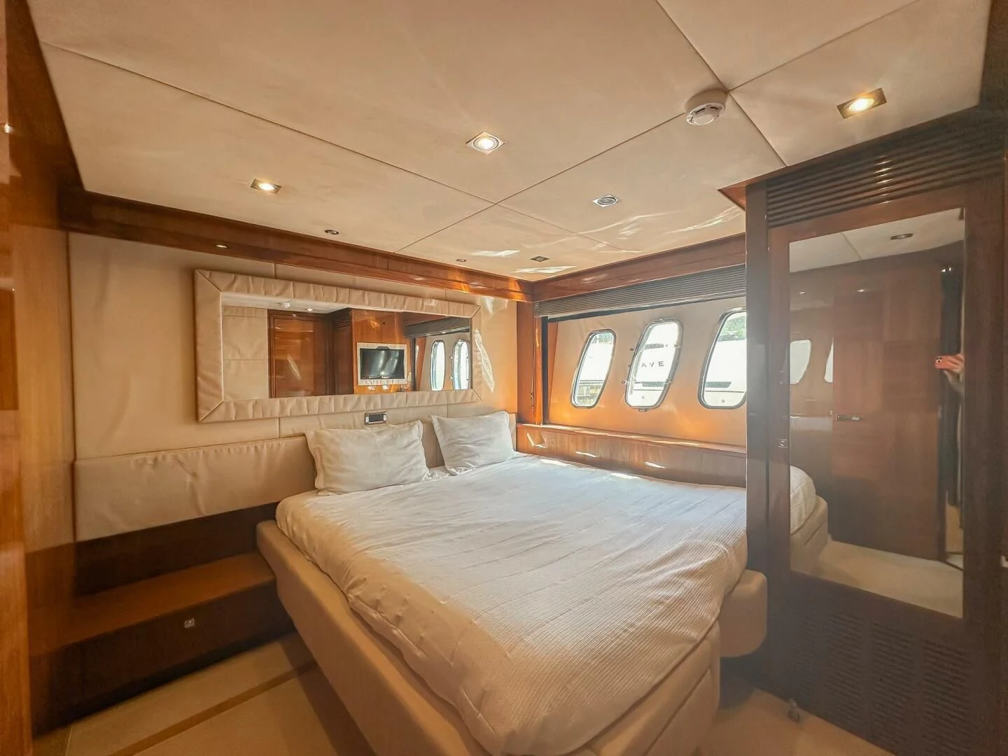 a room with a bed and a window aboard THE CABANA Yacht for Sale