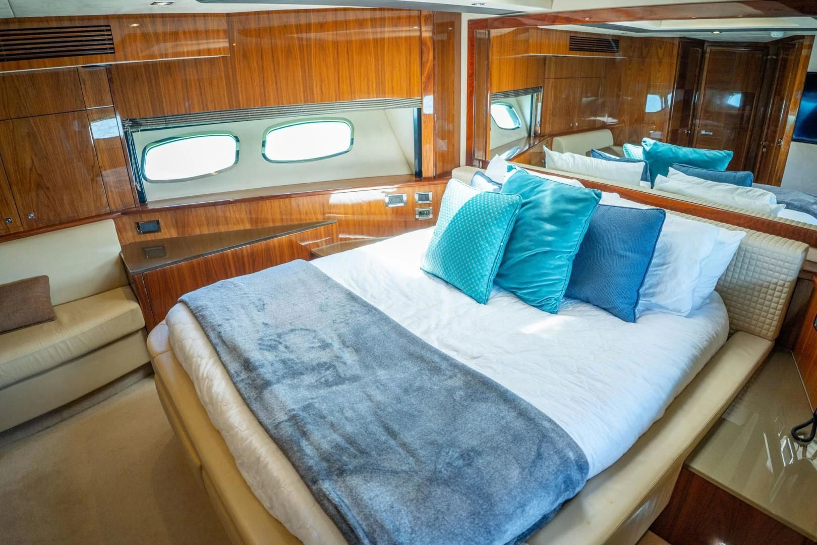 a bed with pillows and a bed aboard THE CABANA Yacht for Sale