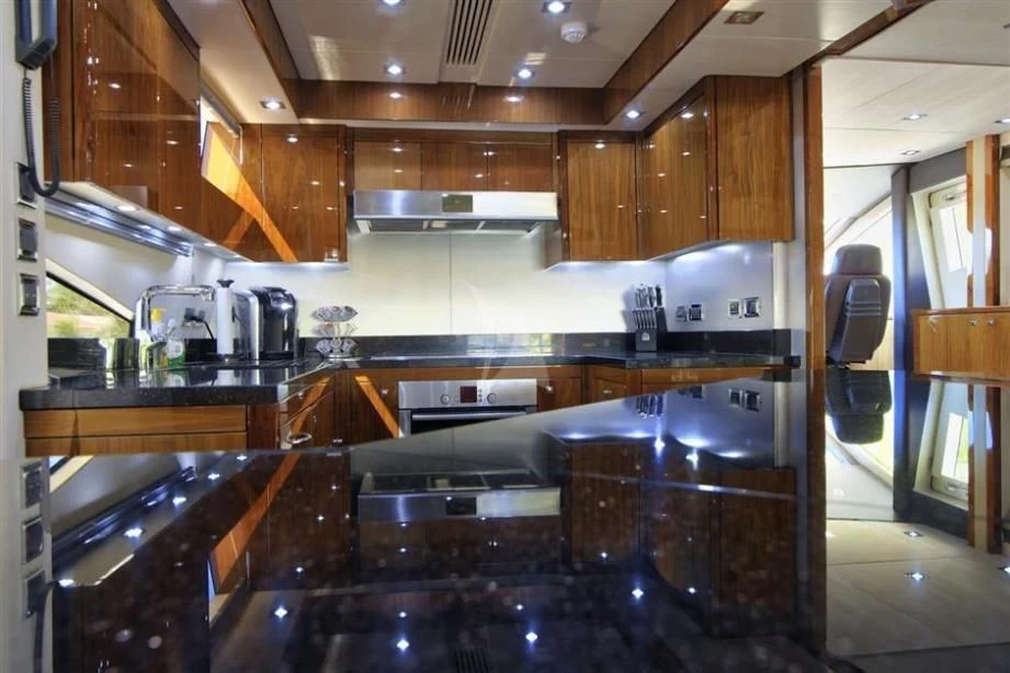 a kitchen with a large island aboard THE CABANA Yacht for Sale