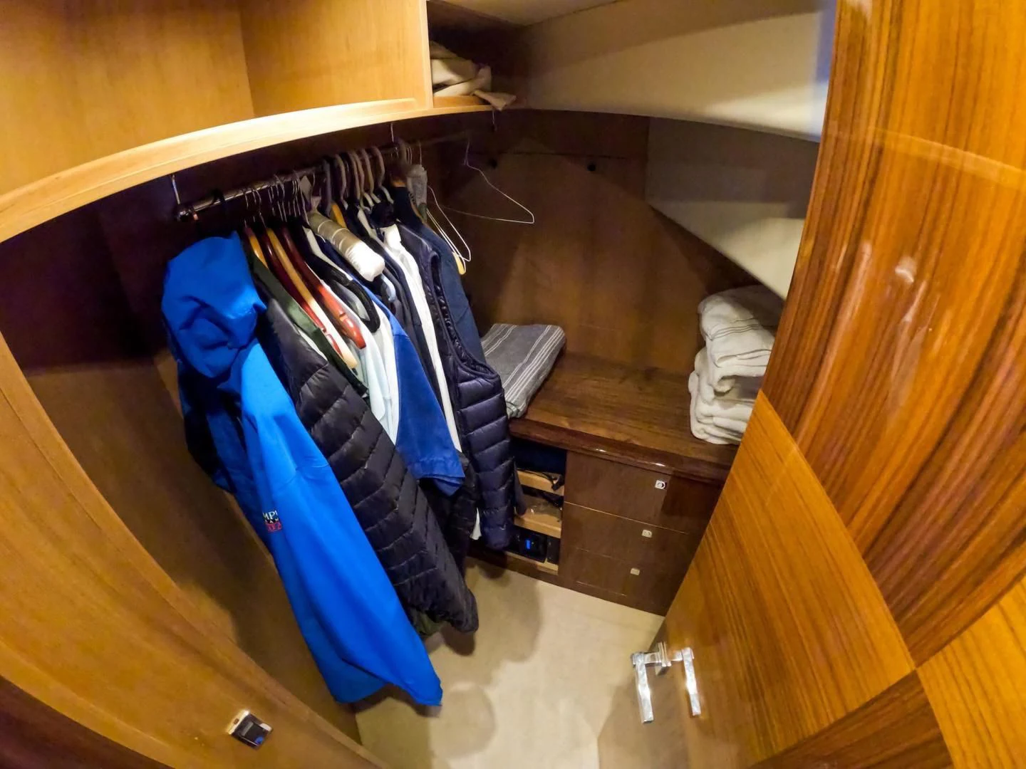 a closet full of clothes aboard THE CABANA Yacht for Sale