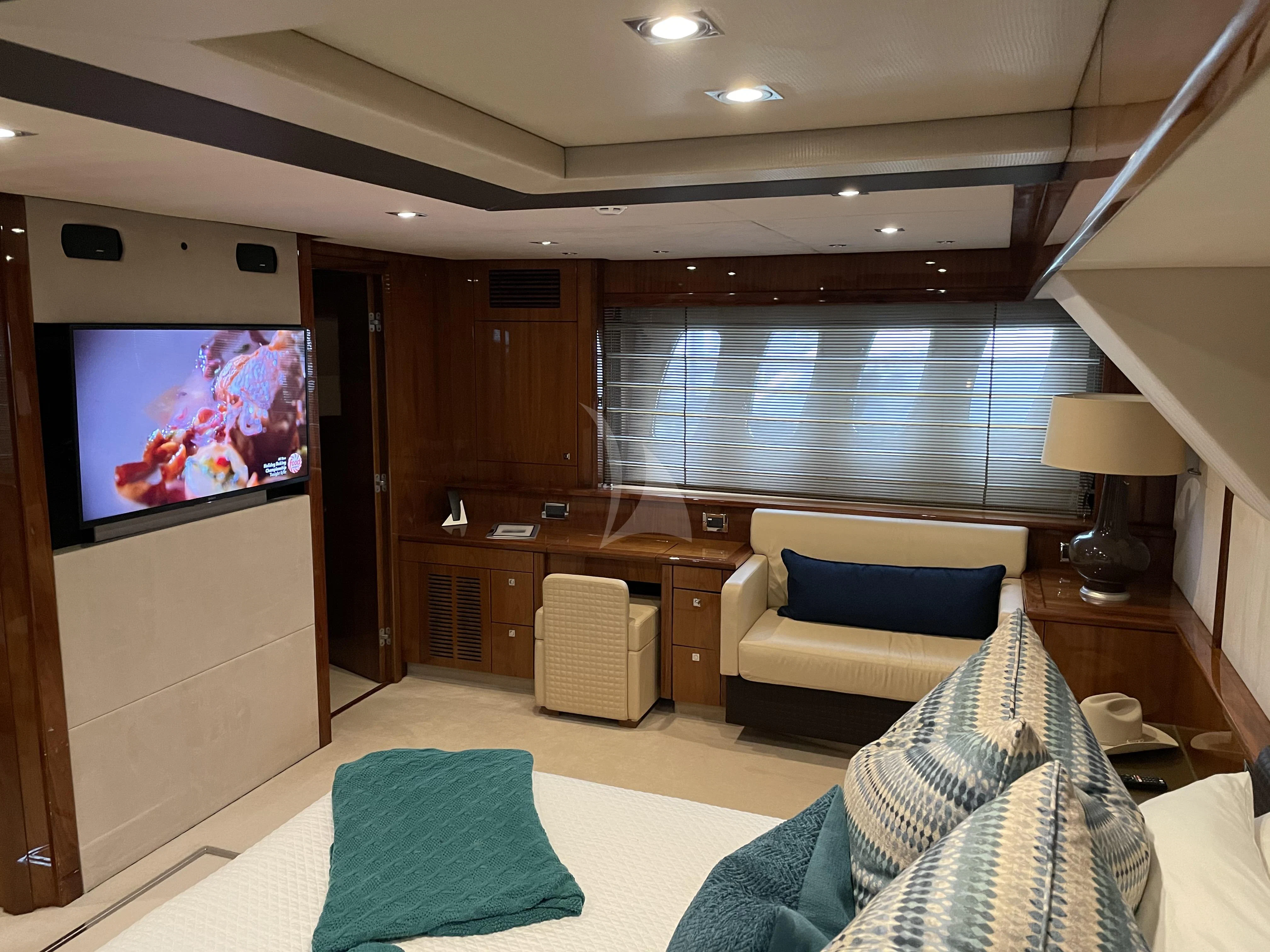 a living room with a large television aboard THE CABANA Yacht for Sale