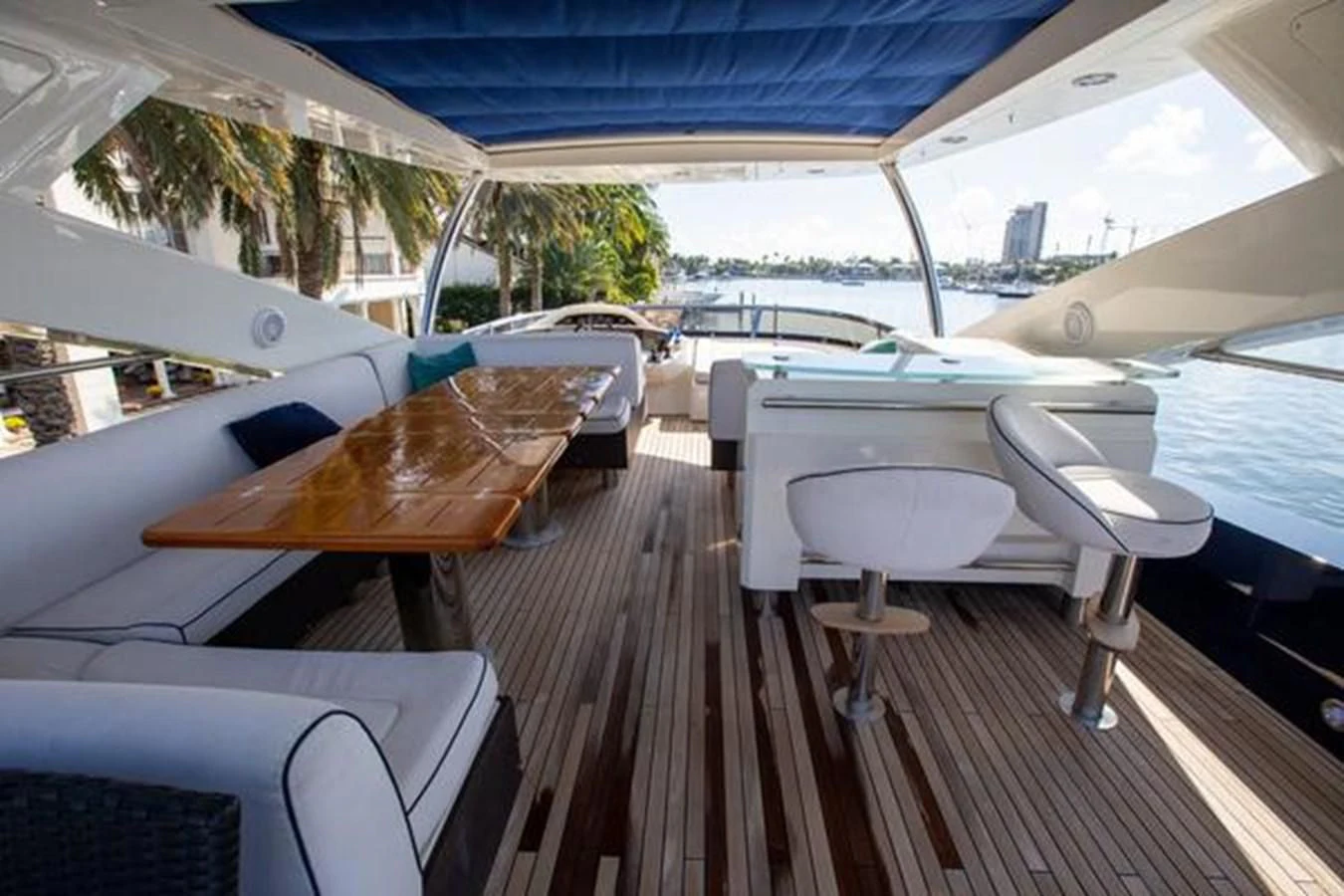 a boat deck with chairs and a boat on it aboard THE CABANA Yacht for Sale
