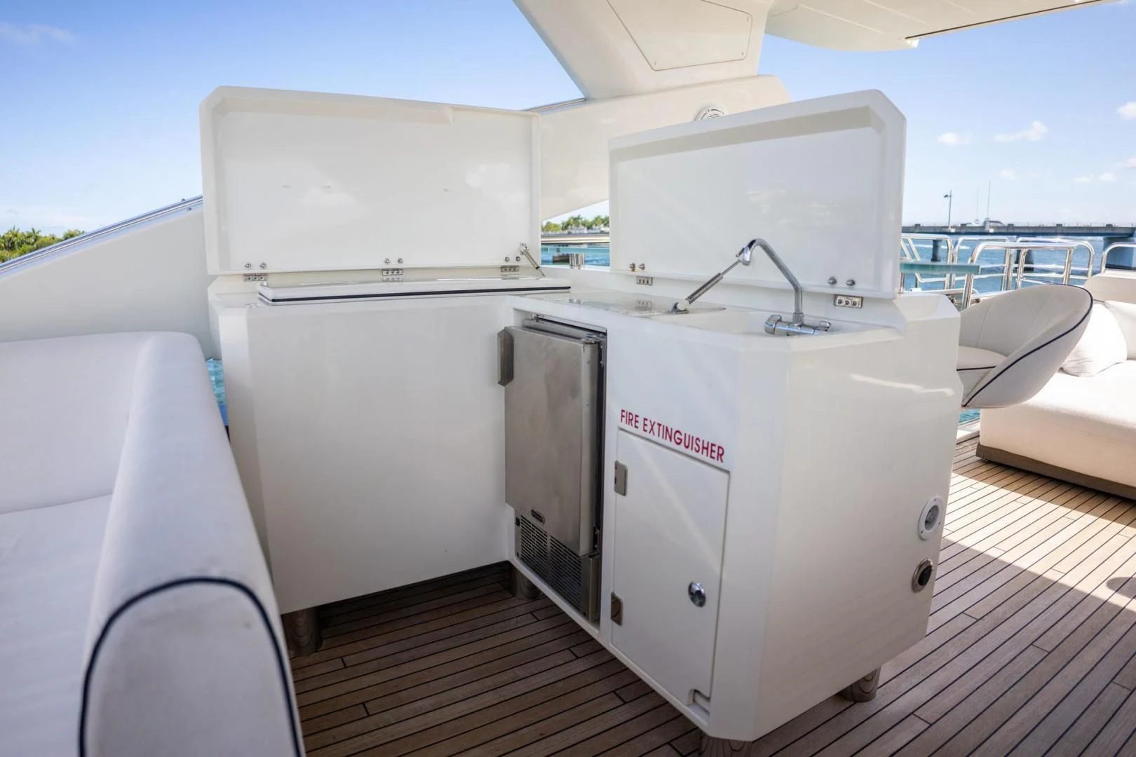 a white machine on a deck aboard THE CABANA Yacht for Sale