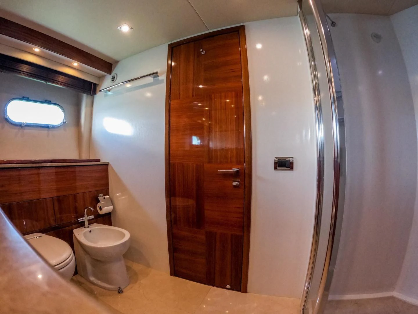 a bathroom with a shower and toilet aboard THE CABANA Yacht for Sale
