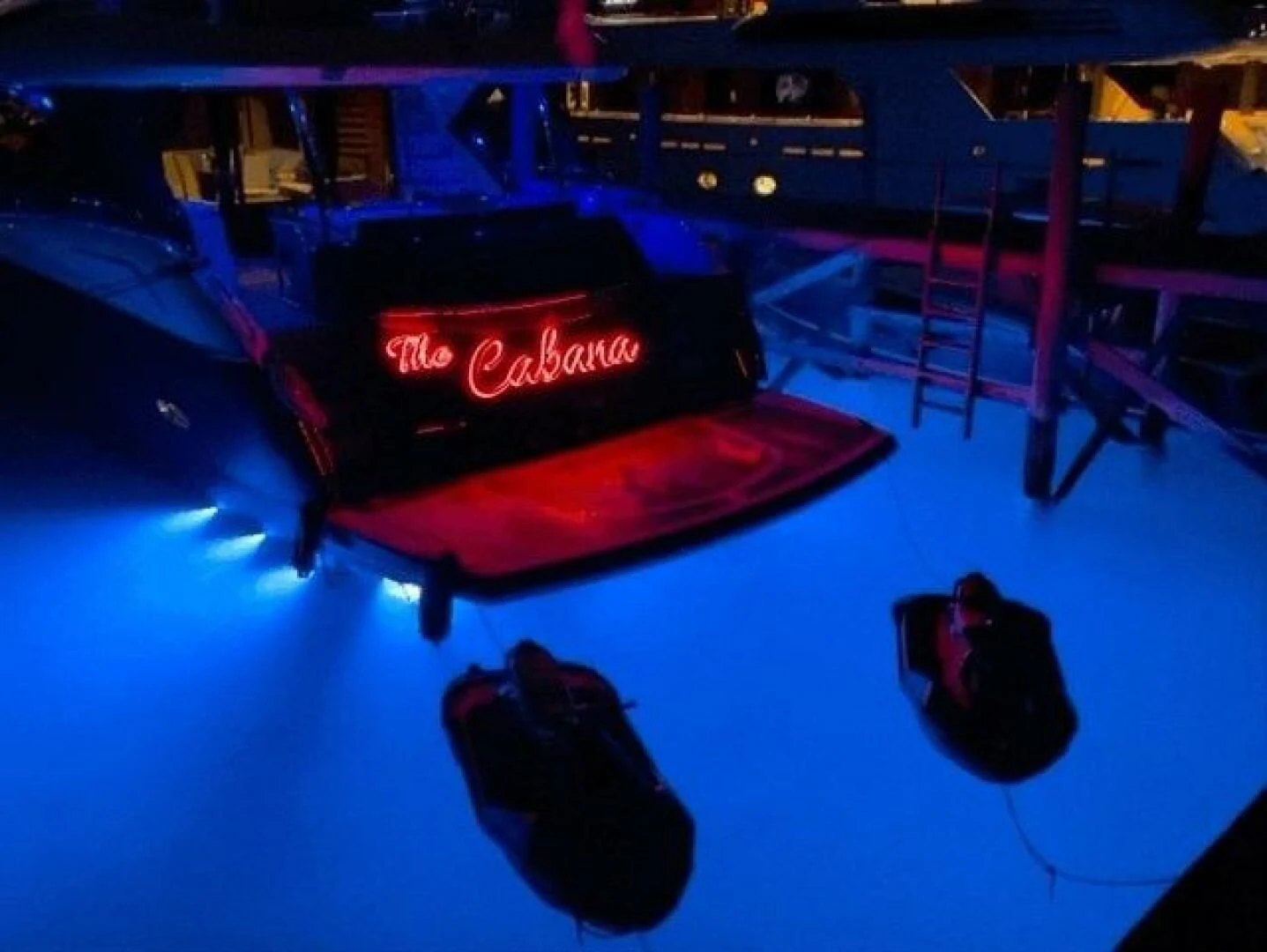 a black car on a blue surface aboard THE CABANA Yacht for Sale