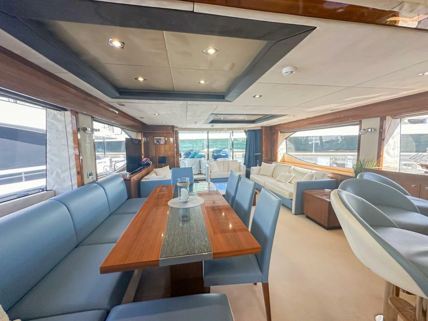 a room with a table and chairs aboard THE CABANA Yacht for Sale