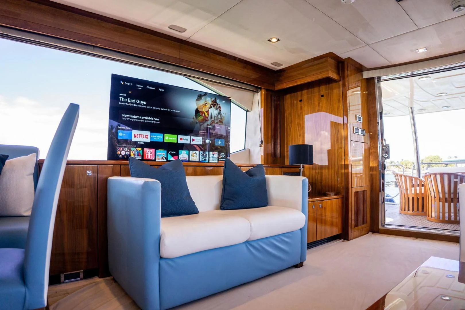 a living room with a large screen aboard THE CABANA Yacht for Sale