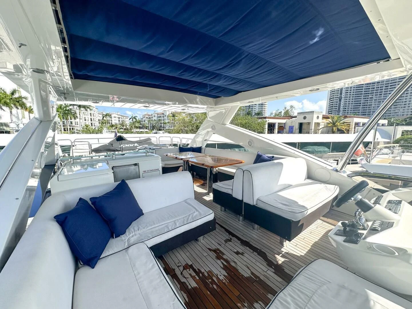 a large room with a large bed and a table aboard THE CABANA Yacht for Sale