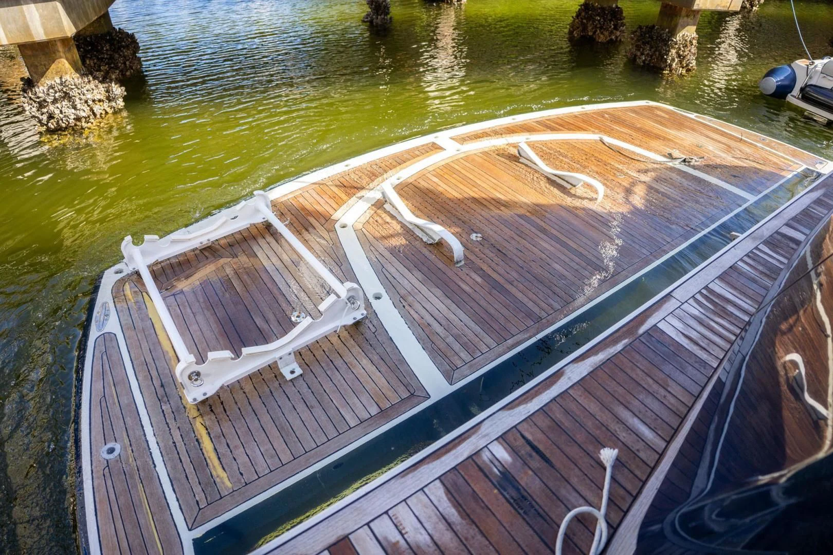 a deck with a water body aboard THE CABANA Yacht for Sale