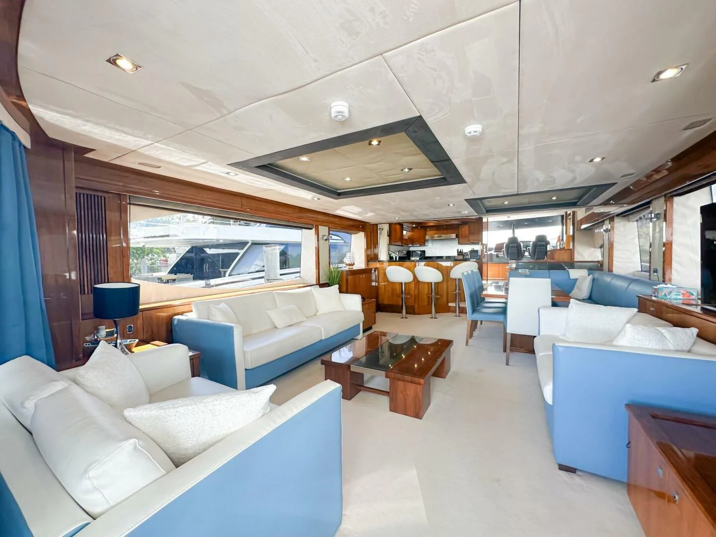 a living room with a large open window aboard THE CABANA Yacht for Sale