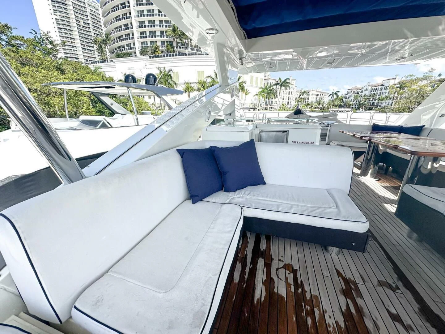 a deck with a view of a city and water aboard THE CABANA Yacht for Sale