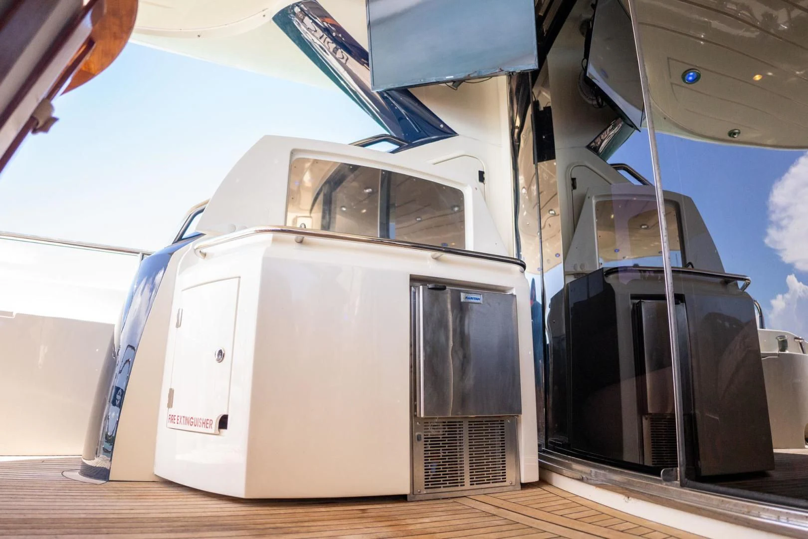 a white rectangular object with a blue screen aboard THE CABANA Yacht for Sale