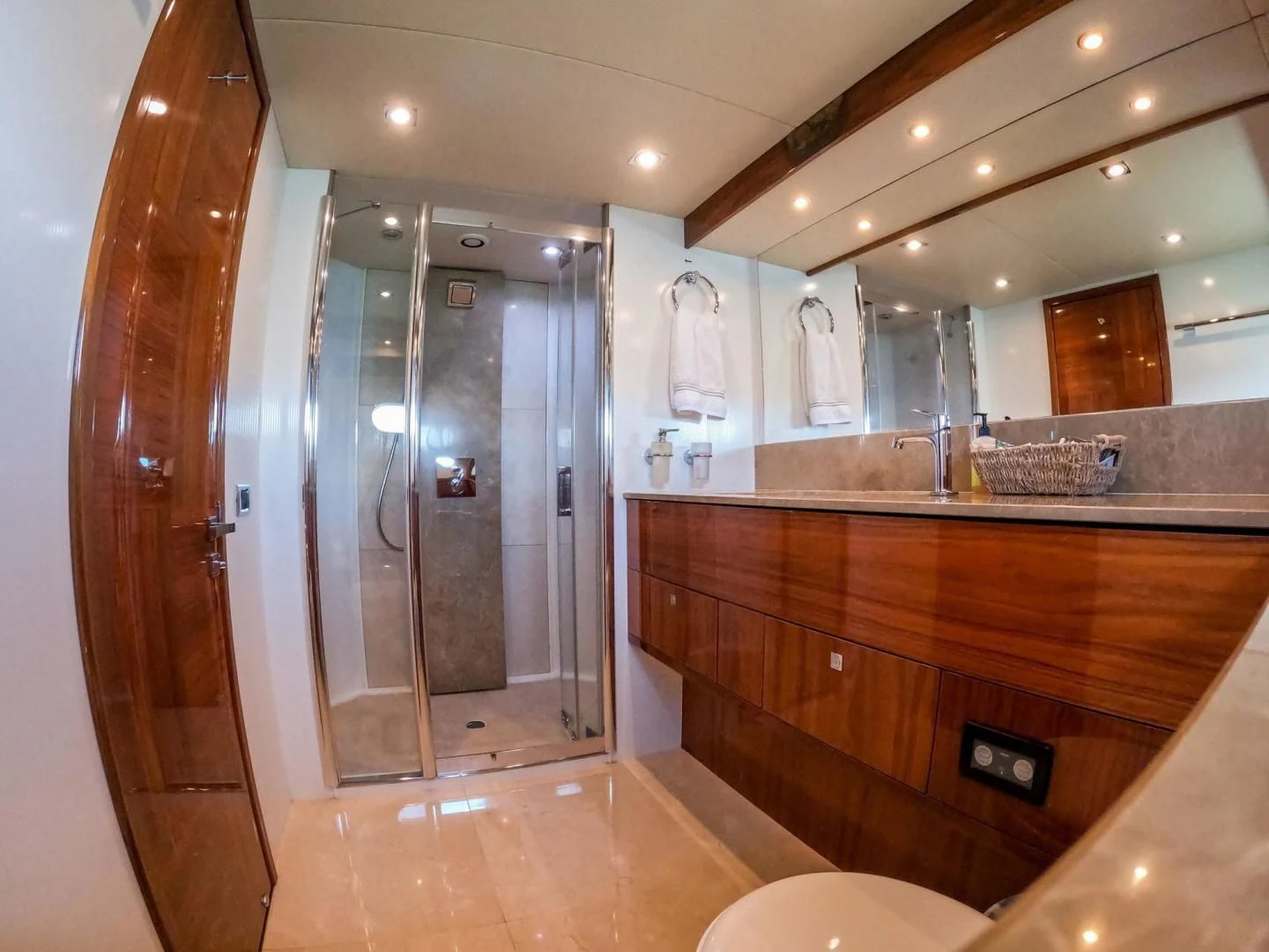 a bathroom with a large mirror aboard THE CABANA Yacht for Sale