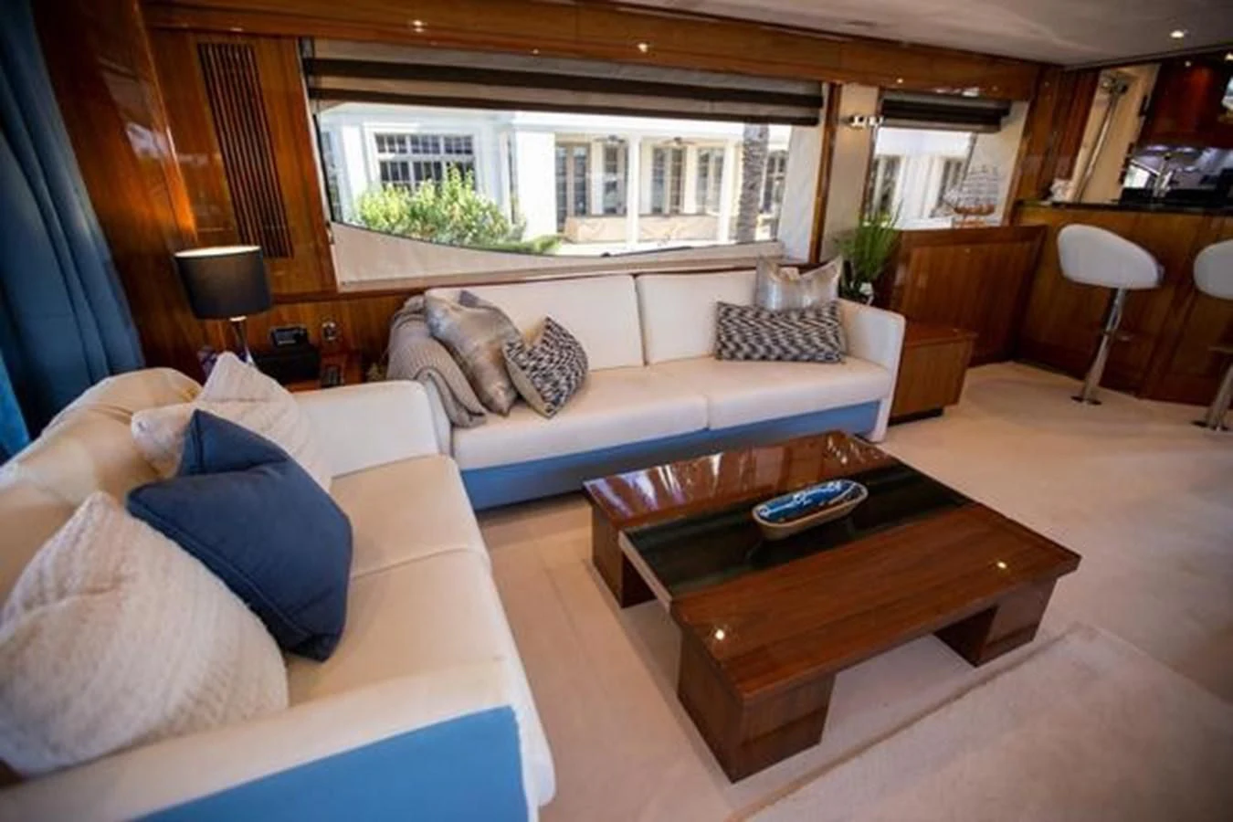 a living room with a couch and a coffee table aboard THE CABANA Yacht for Sale