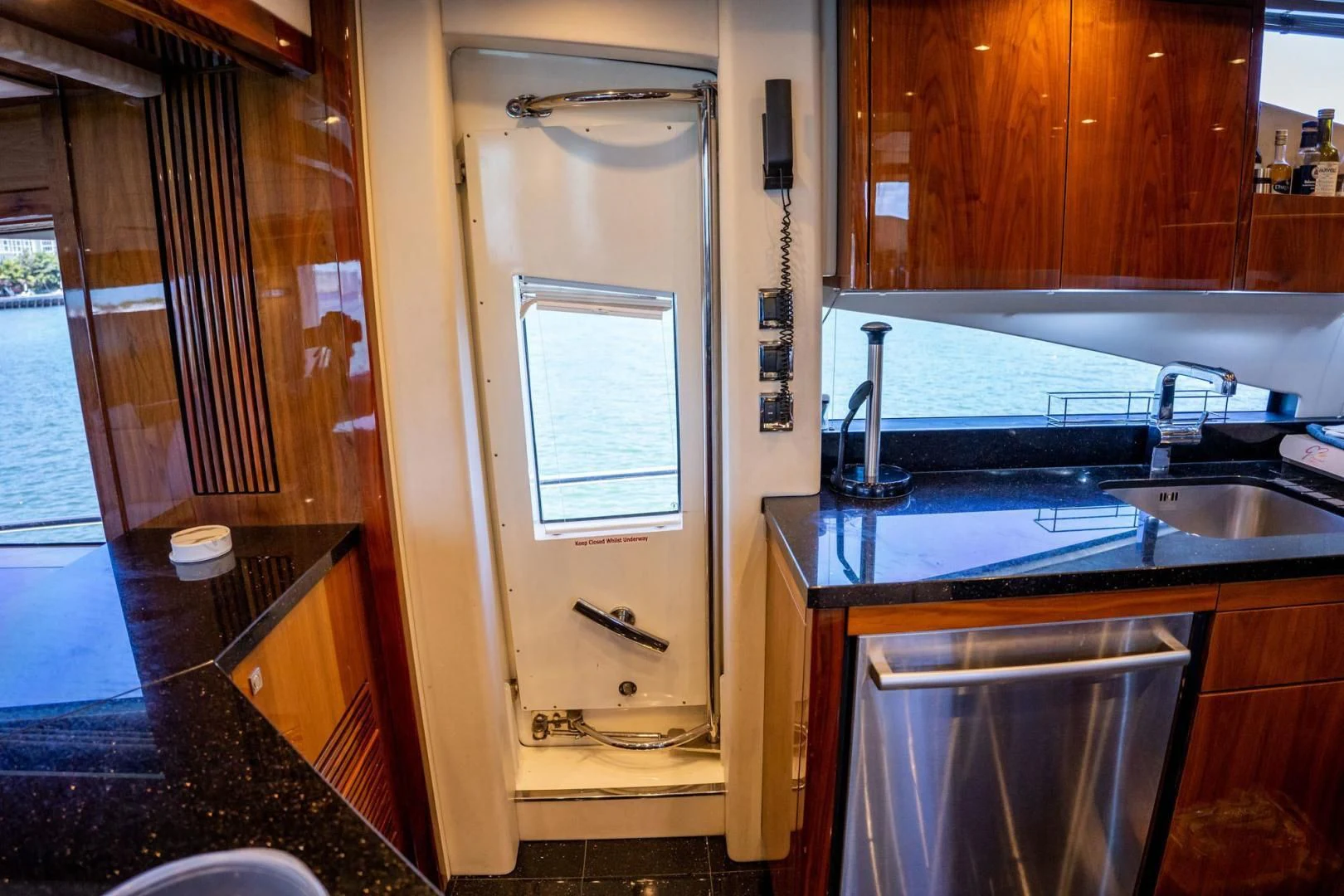 a bathroom with a sink and a window aboard THE CABANA Yacht for Sale