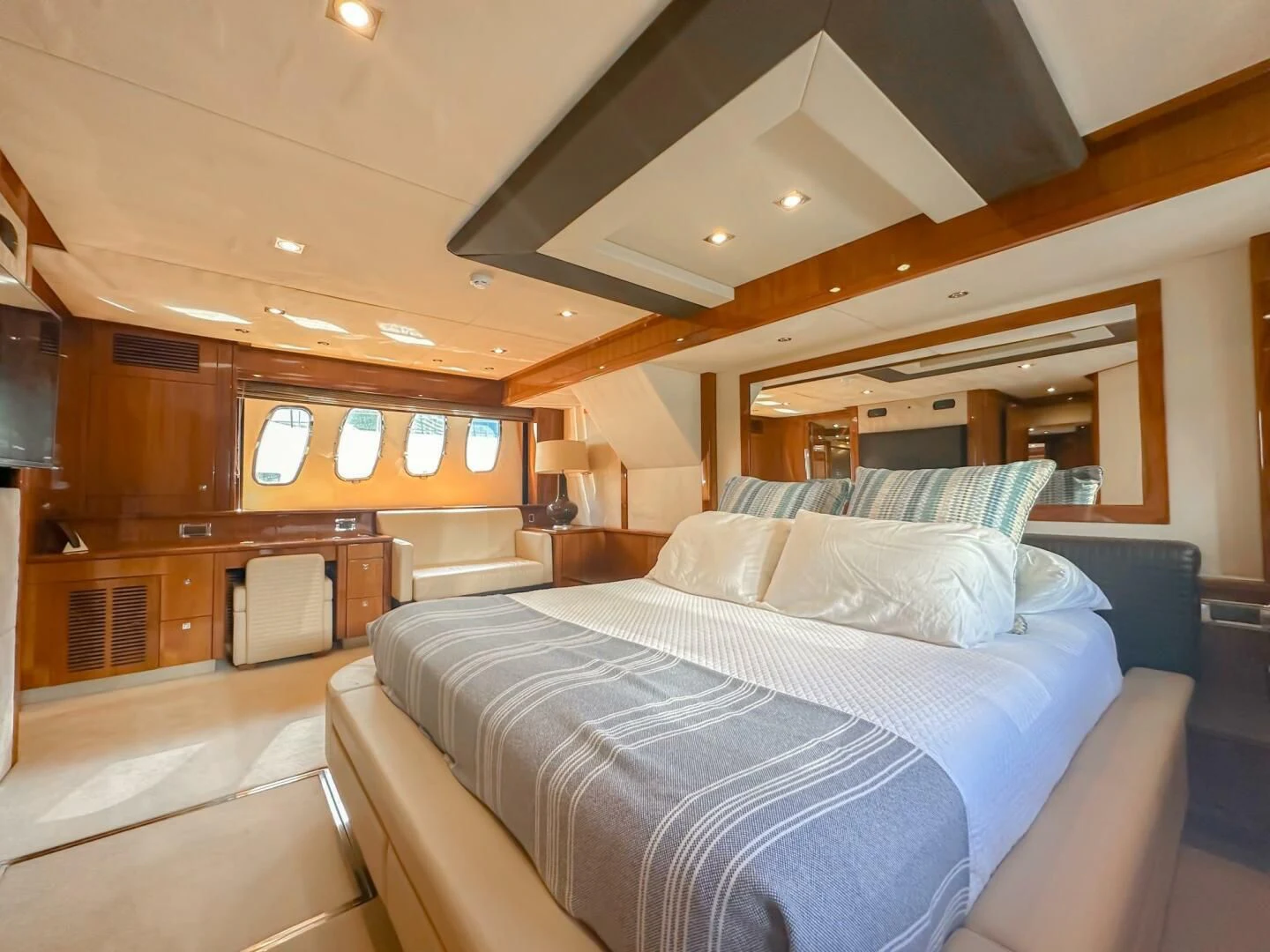 a large bedroom with a large bed aboard THE CABANA Yacht for Sale
