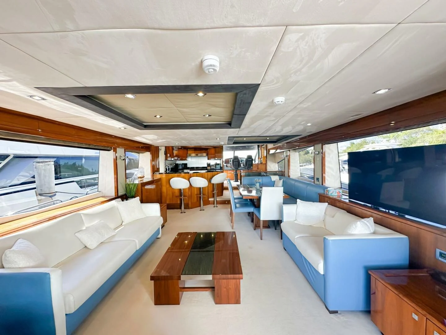 a room with a couch and a table and chairs aboard THE CABANA Yacht for Sale