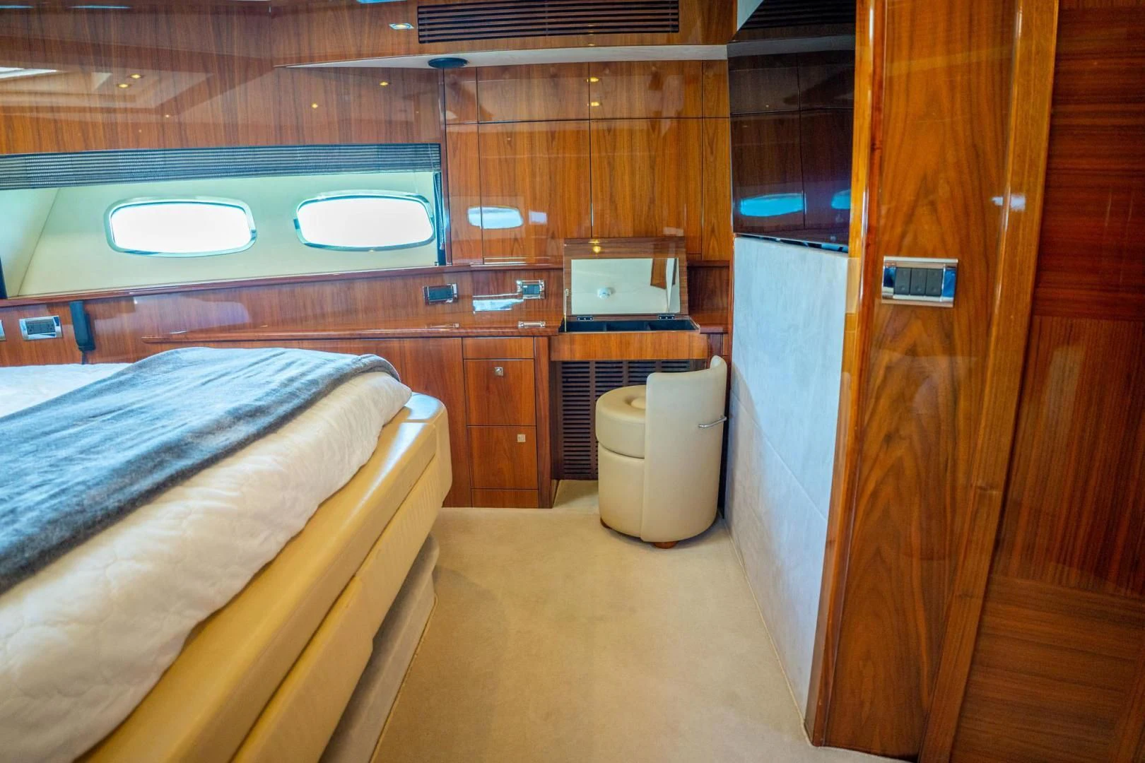 a room with a bed and a television aboard THE CABANA Yacht for Sale