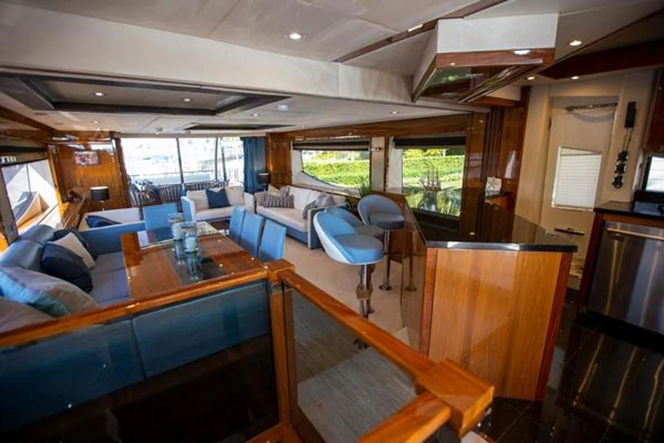 a room with a table chairs and a window aboard THE CABANA Yacht for Sale