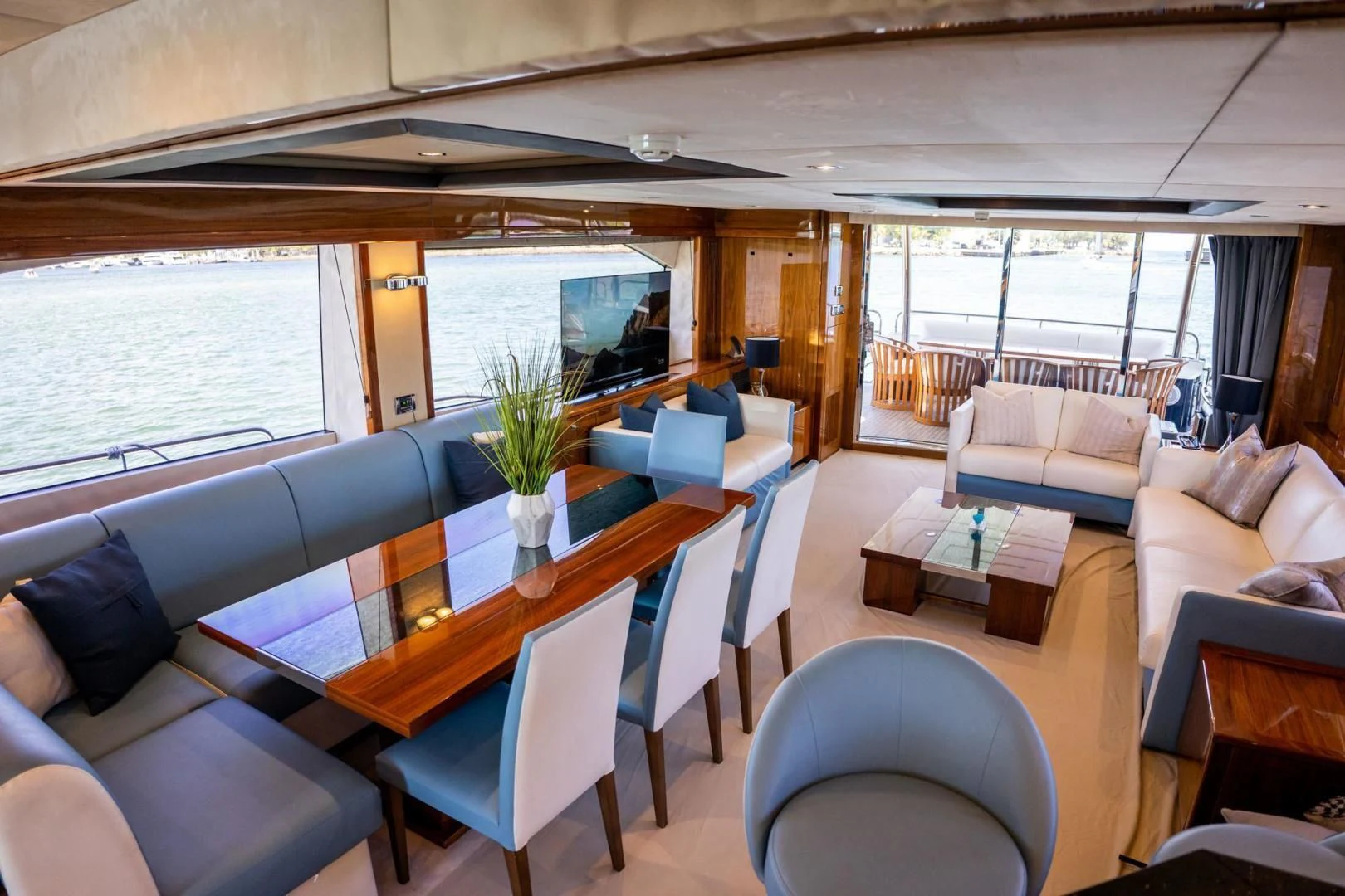 a dining room with a large table aboard THE CABANA Yacht for Sale