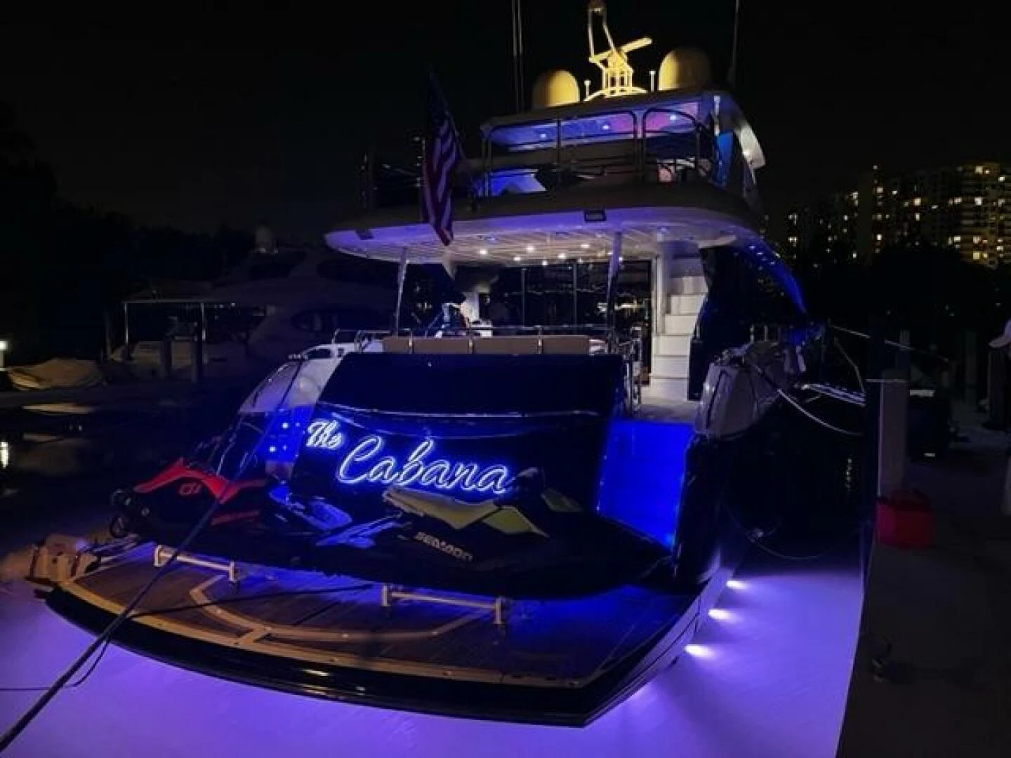 a blue and black race car aboard THE CABANA Yacht for Sale