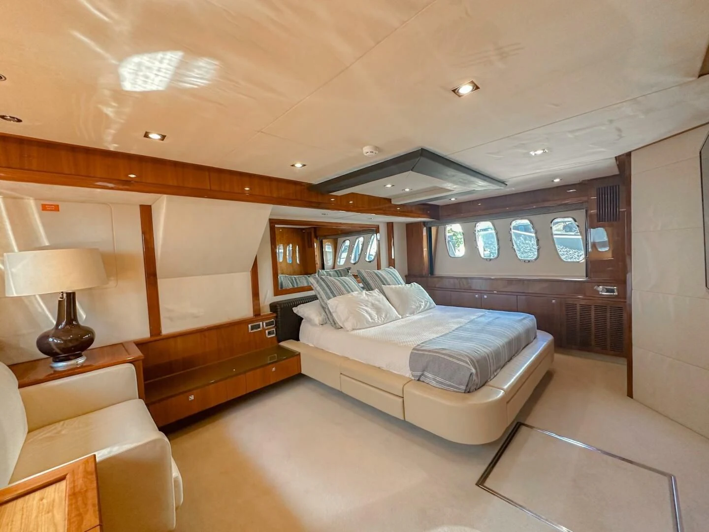 a room with a bed and a couch aboard THE CABANA Yacht for Sale