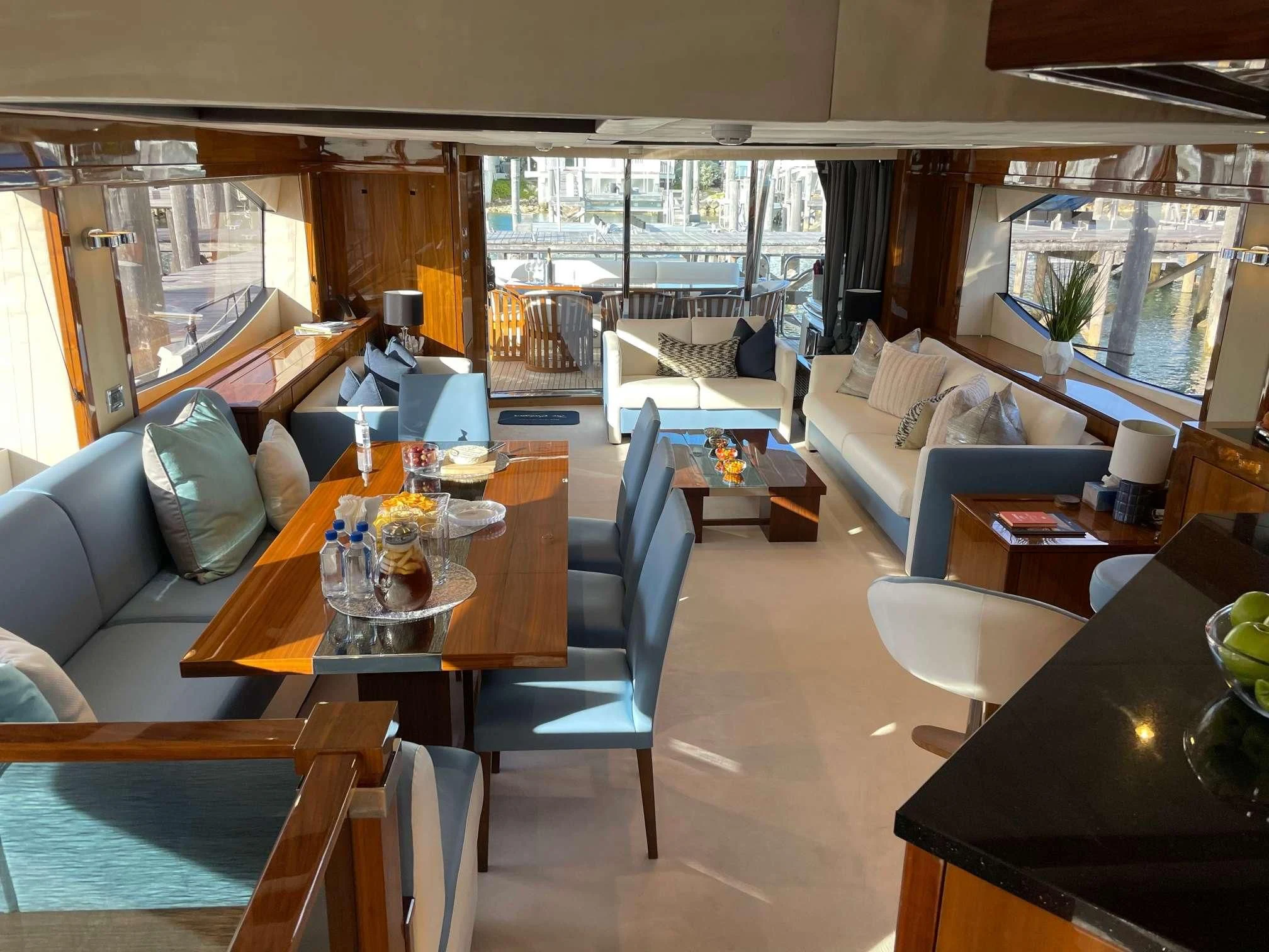 a living room with a large window aboard THE CABANA Yacht for Sale