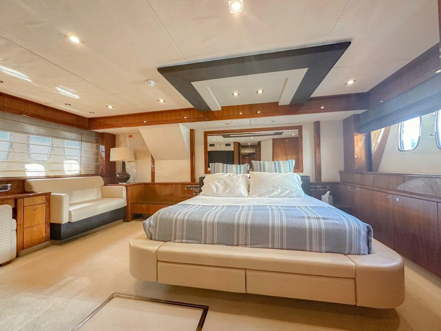 a large bedroom with a bed aboard THE CABANA Yacht for Sale