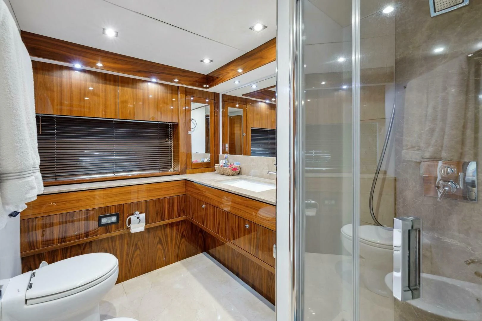 a bathroom with a glass shower aboard THE CABANA Yacht for Sale