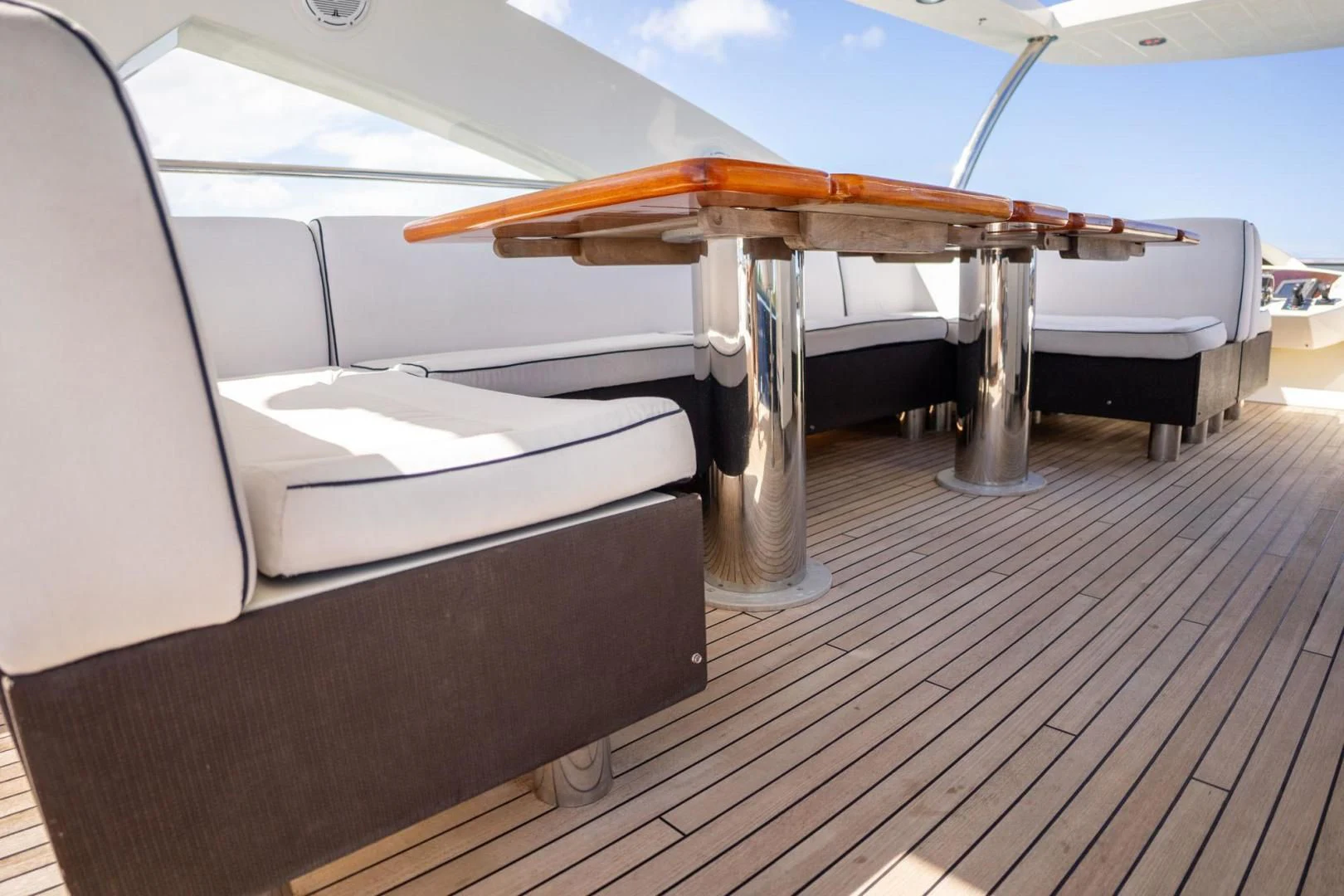 a surfboard on a table aboard THE CABANA Yacht for Sale