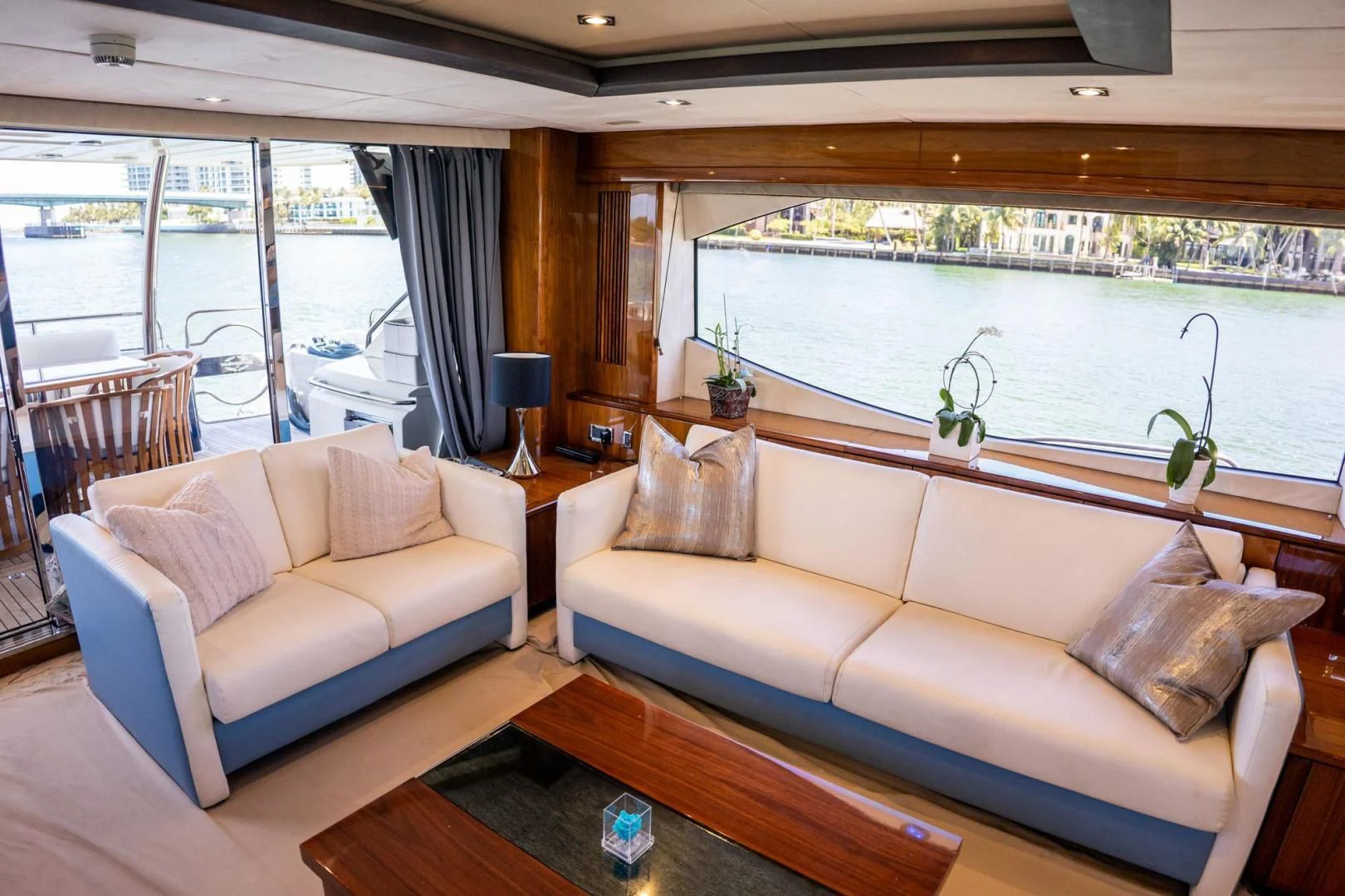 a living room with a large window aboard THE CABANA Yacht for Sale