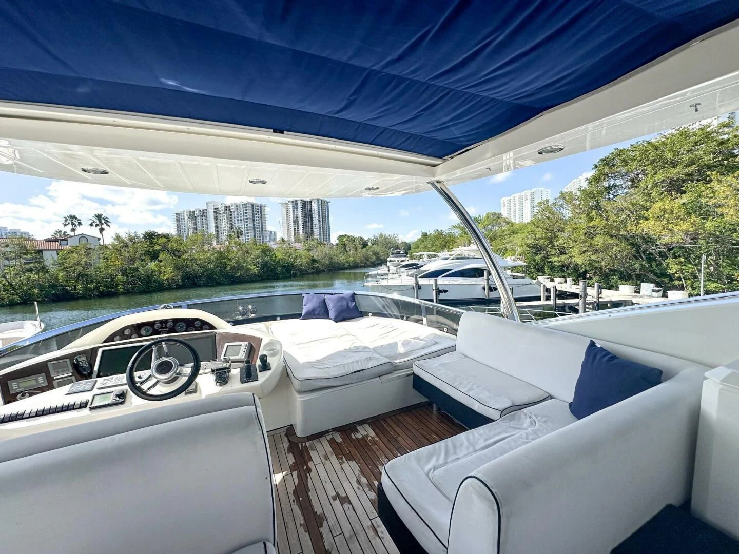 a room with a view of a city and a large body of water aboard THE CABANA Yacht for Sale