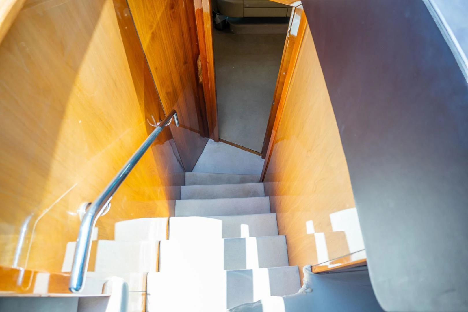 a staircase with a metal railing aboard THE CABANA Yacht for Sale