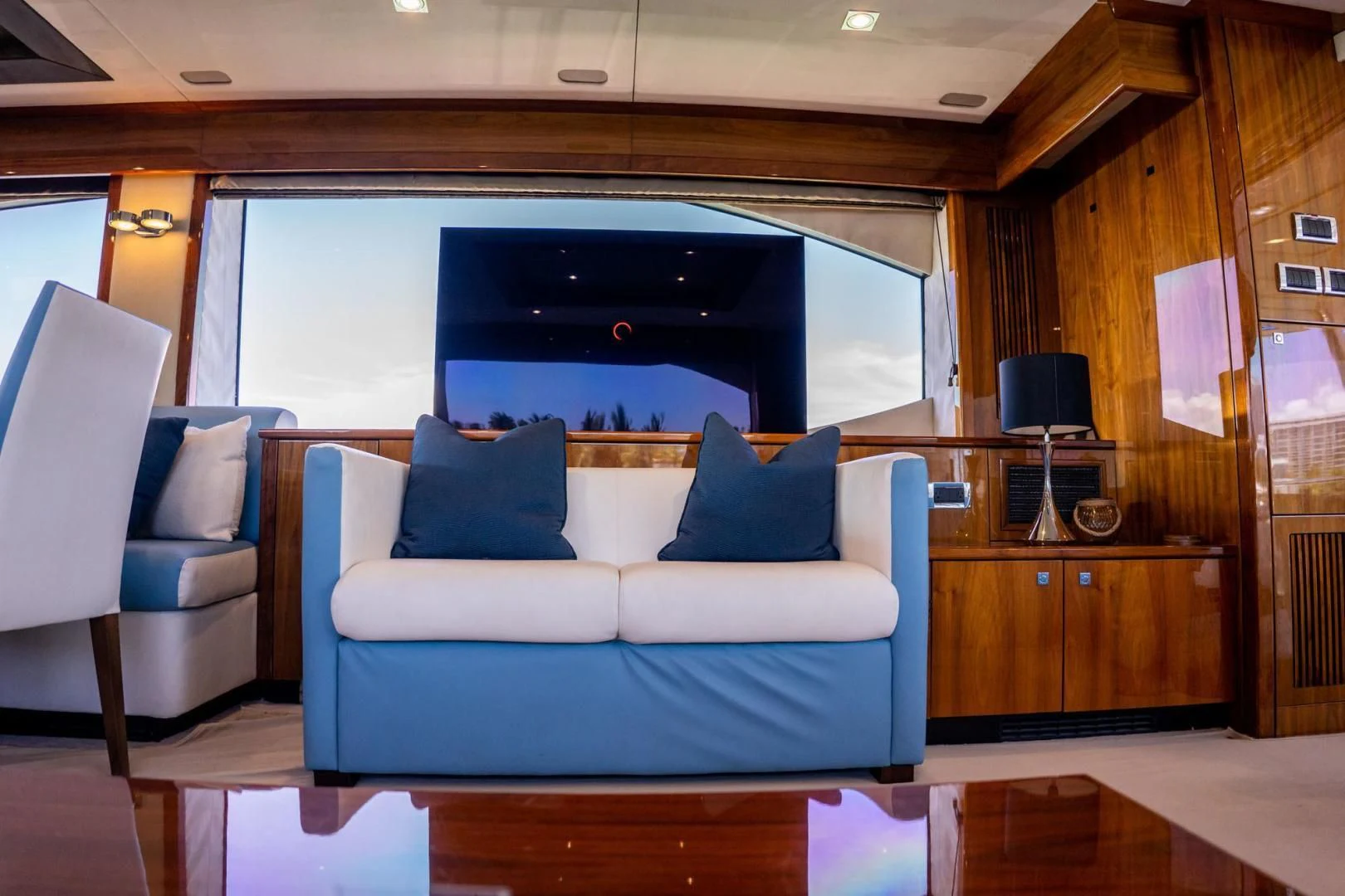 a blue couch in a room aboard THE CABANA Yacht for Sale