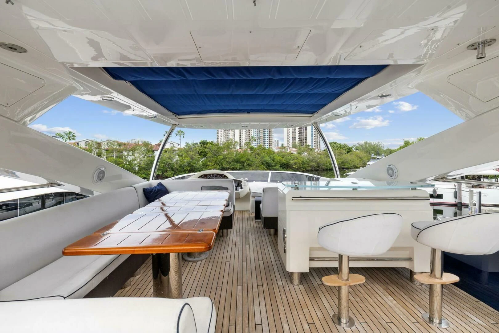 a boat with tables and chairs aboard THE CABANA Yacht for Sale
