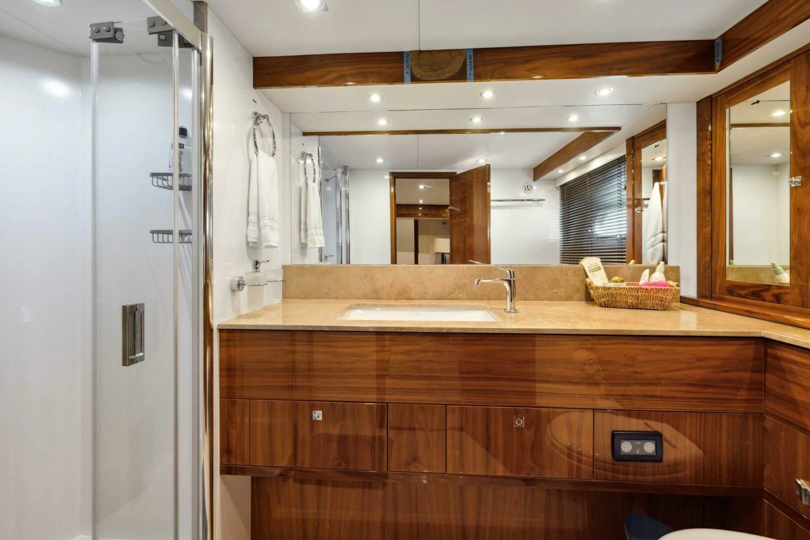 a bathroom with a countertop sink and cabinets aboard THE CABANA Yacht for Sale